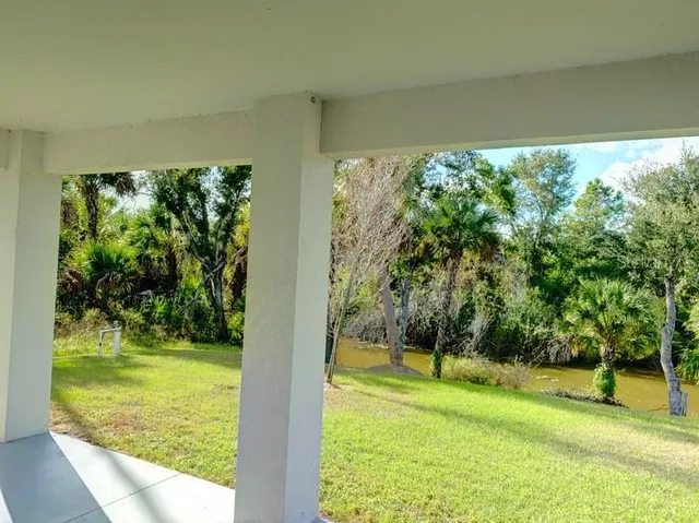 a view of swimming pool from a yard