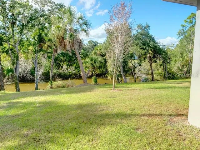 a view of field with trees
