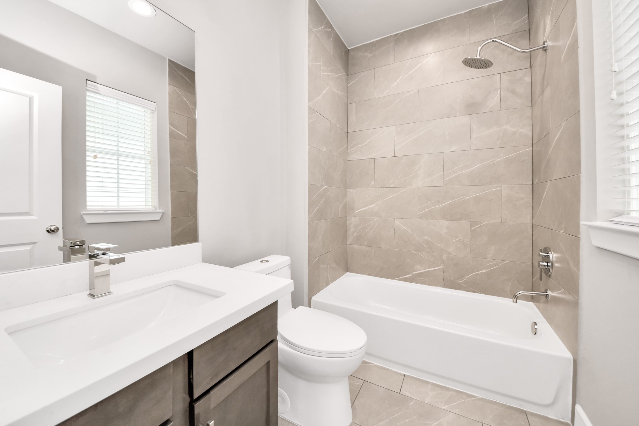 2114 Stuart Street Houston, TX 77004 - Photo 24 of 39 a bathroom with a sink a toilet and bathtub