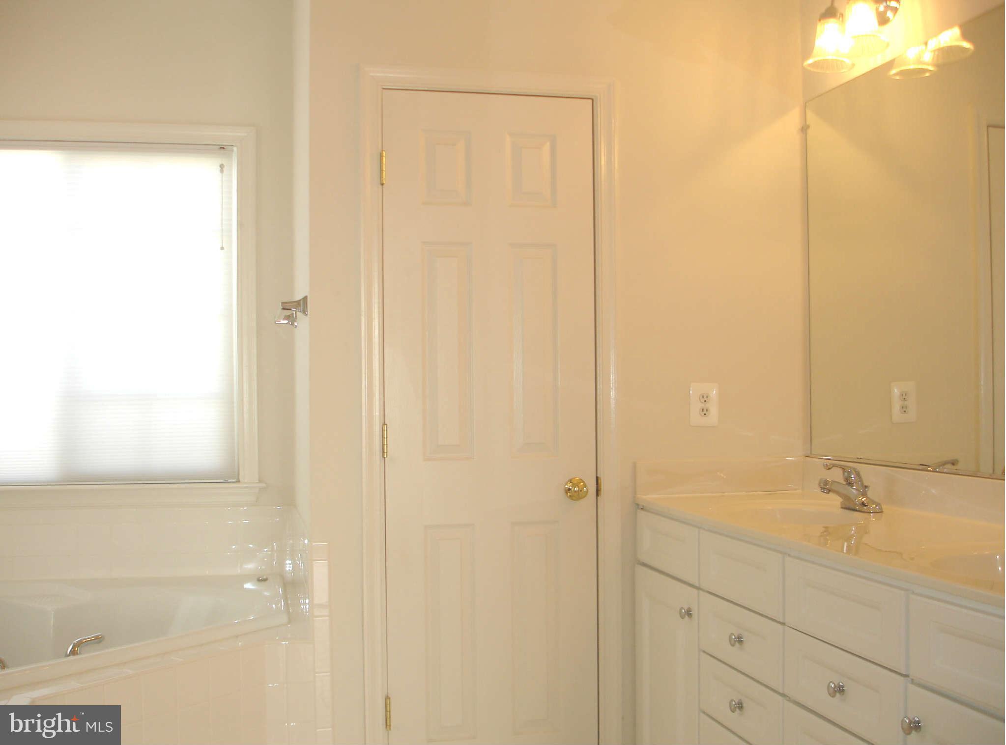 739 Blossom Tree Road Culpeper, VA 22701 - Photo 7 of 15 Raised-panel cabinetry & separate water closet