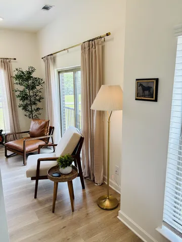 a living room with furniture and a window