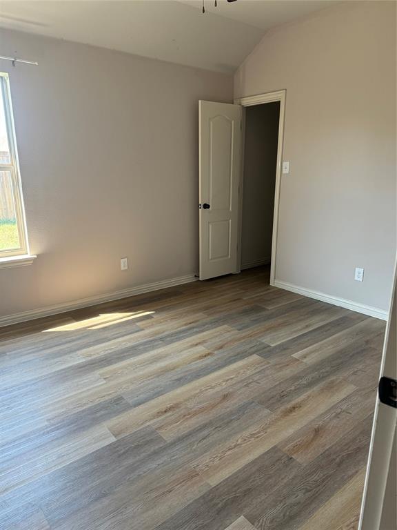236 Archer Way Forney, TX 75126 - Photo 19 of 35 an empty room with wooden floor and windows