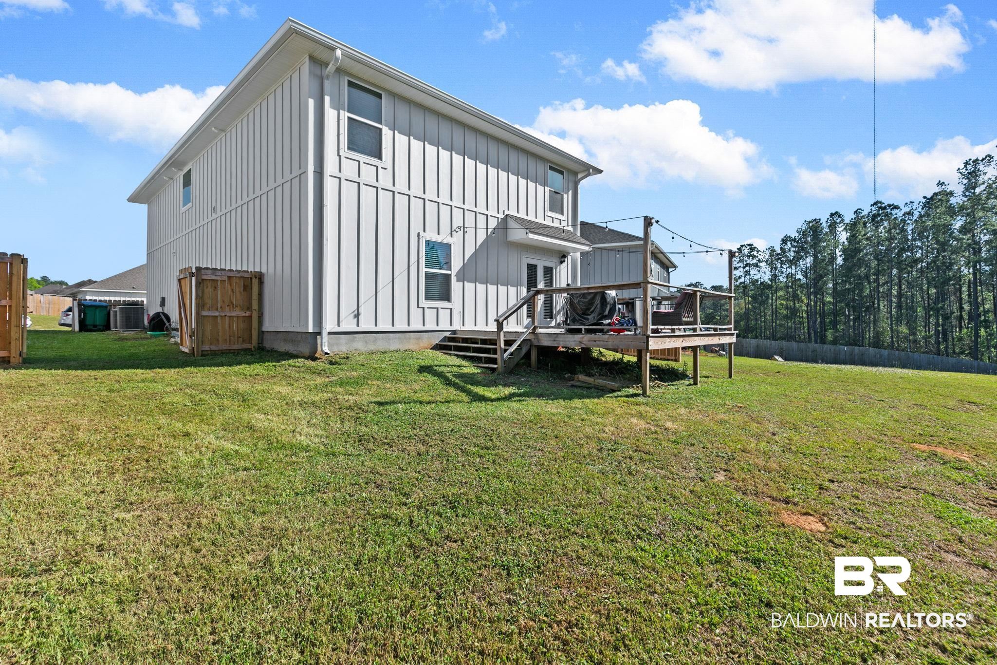 32234 Calder Court Daphne, AL 36527 - Photo 28 of 32 Back of house featuring board and batten siding and a deck
