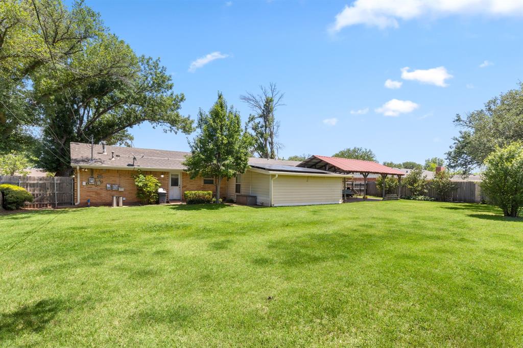 4504 Jennings Avenue Wichita Falls, TX 76310 - Photo 26 of 26 a front view of a house with a garden and yard