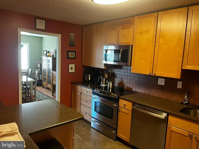 a living room with furniture and a lamp