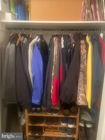 a living room with furniture a chandelier and a fireplace