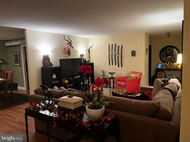 a living room with furniture and a view of living room