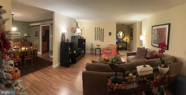 a view of a room with furniture and a lamp