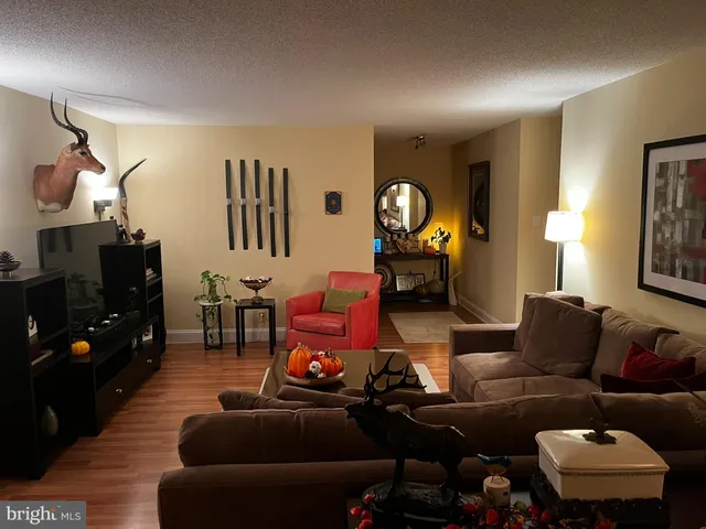 a bedroom with a bed and lamp