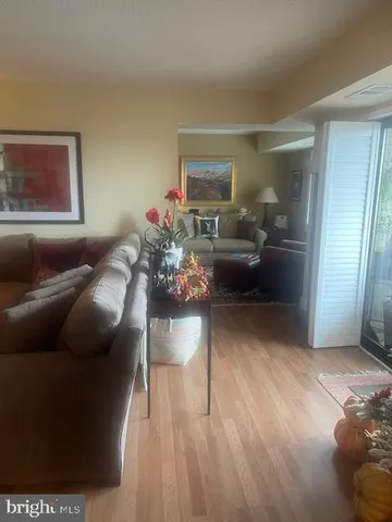 a view of living room with furniture and chandelier