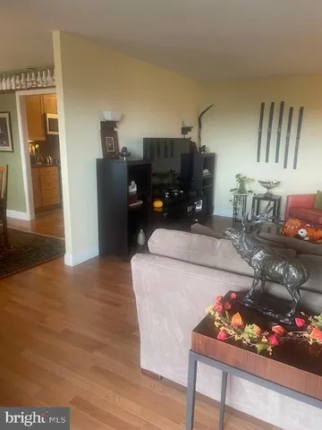 a room with furniture pool table and book shelf