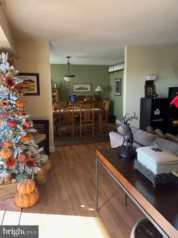 a view of kitchen with stainless steel appliances granite countertop