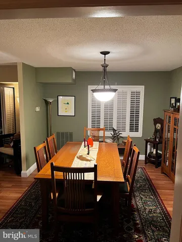 a view of a car is parked in front of a house