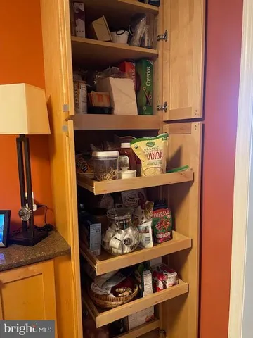 a kitchen with a sink cabinets and a table
