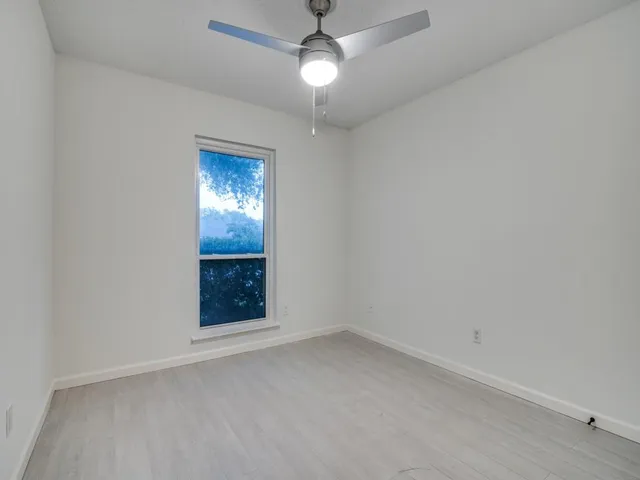 an empty room with a bathroom