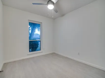 an empty room with a bathroom