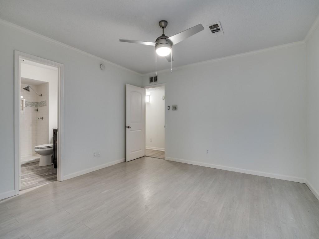 3425 Tarkio Road Plano, TX 75074 - Photo 18 of 25 an empty room with fan and entrance