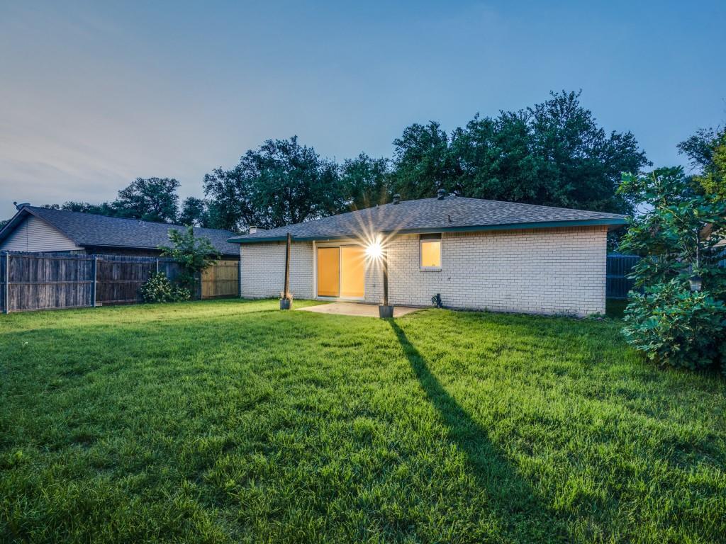 3425 Tarkio Road Plano, TX 75074 - Photo 23 of 25 a front view of house with yard and green space