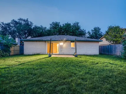 a backyard of a house with lots of green space