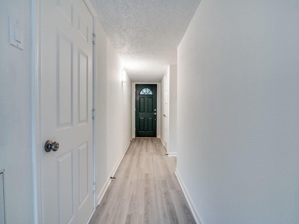 3425 Tarkio Road Plano, TX 75074 - Photo 4 of 25 a view of a hallway with wooden floor