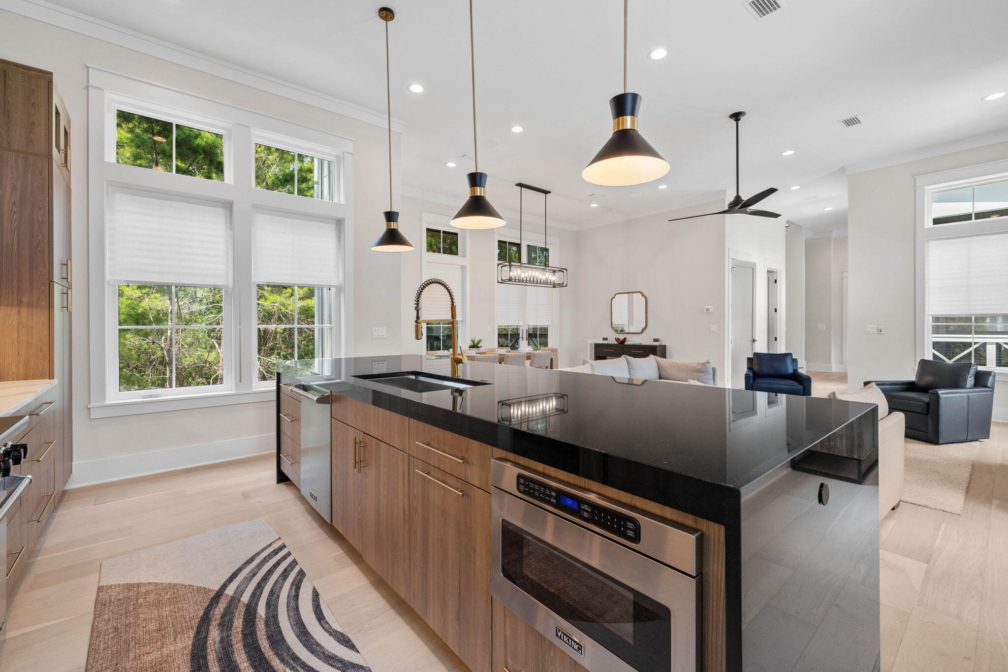 3232 West County Highway 30A Santa Rosa Beach, FL 32459 - Photo 5 of 12 a kitchen with stainless steel appliances granite countertop a sink a stove and a wooden floors