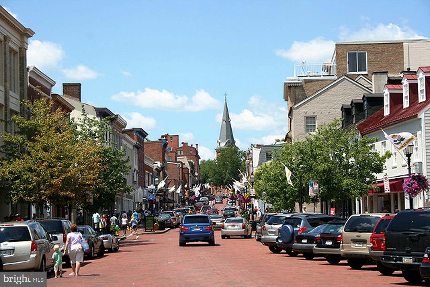 2991 Solomons Island Road Edgewater, MD 21037 - Photo 3 of 5 a city street lined with parked cars and buildings