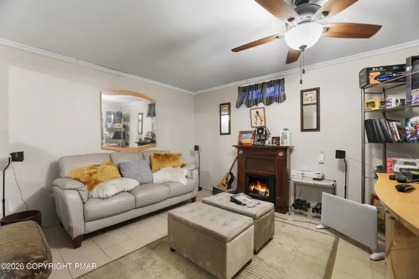 a living room with furniture and a fireplace