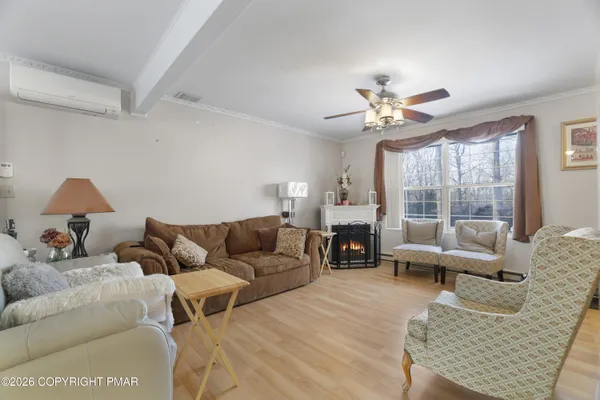 a living room with furniture and a large window
