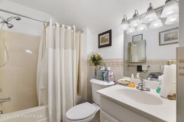 a white bath tub sitting in a bathroom