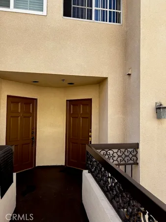 a view of a utility room with wooden door