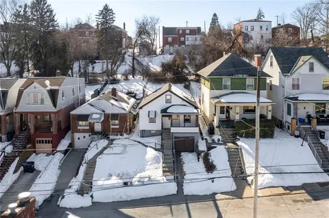 a view of multiple houses with a city street