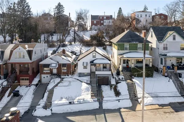 a view of multiple houses with a city street
