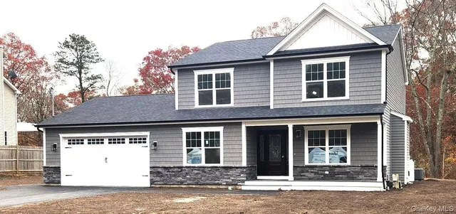 a front view of a house with a garage