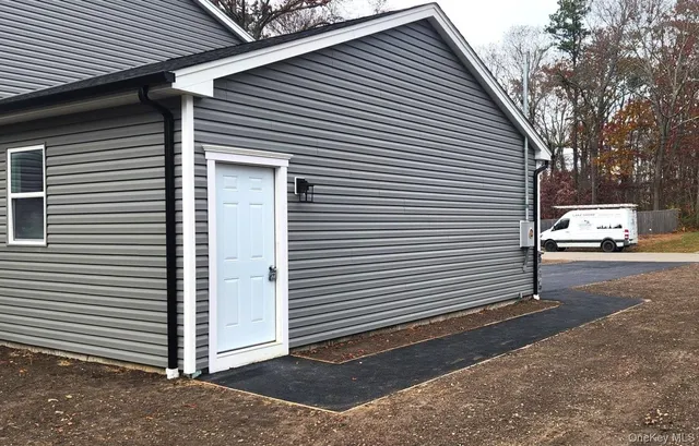 a view of a car in front of a house