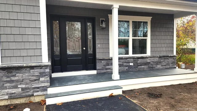 a view of entrance of the house and front door