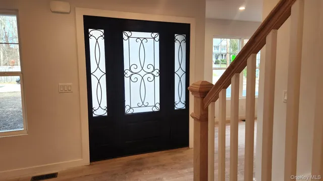 a view of an entryway with staircase