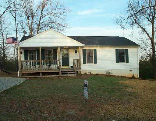 2534 Sandy Level Road Goodview, VA 24095 - Photo 1 of 2 a backyard of a house with table and chairs