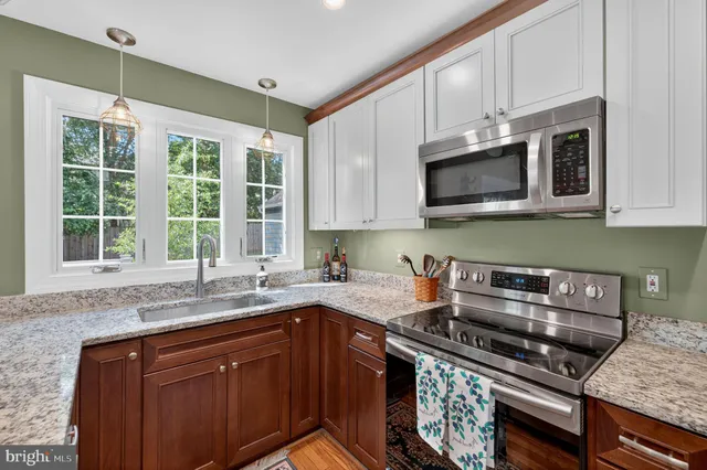 a living room with furniture and a chair