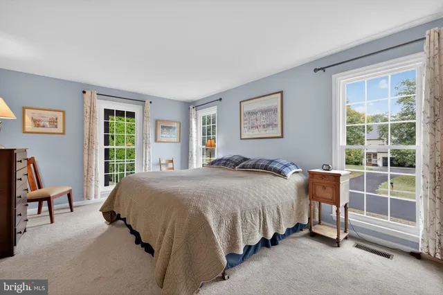 a view of a house with a yard porch and furniture