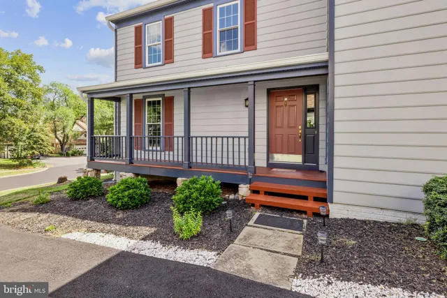 a view of a livingroom with furniture and hardwood floor