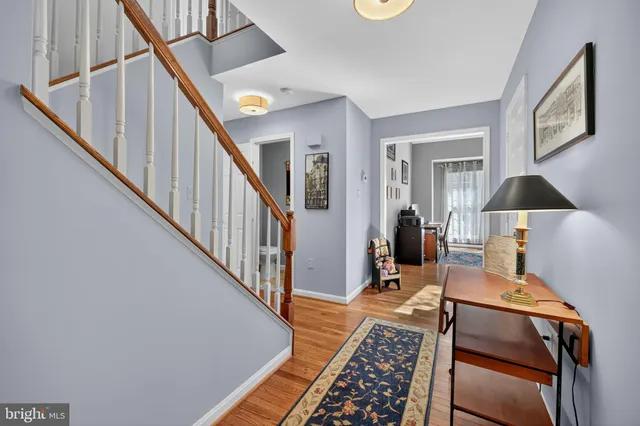 a bedroom with a bed and dresser with mirror