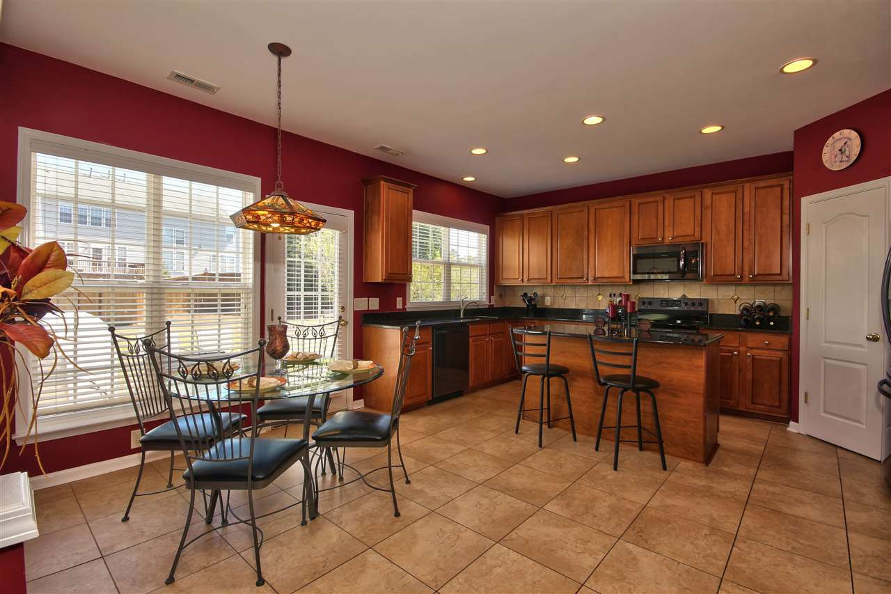 7616 Derek Drive Raleigh, NC 27613 - Photo 10 of 25 Enjoy a cup of coffee in your breakfast room and throw open the door to take in your wonderful back yard. Breakfast Room