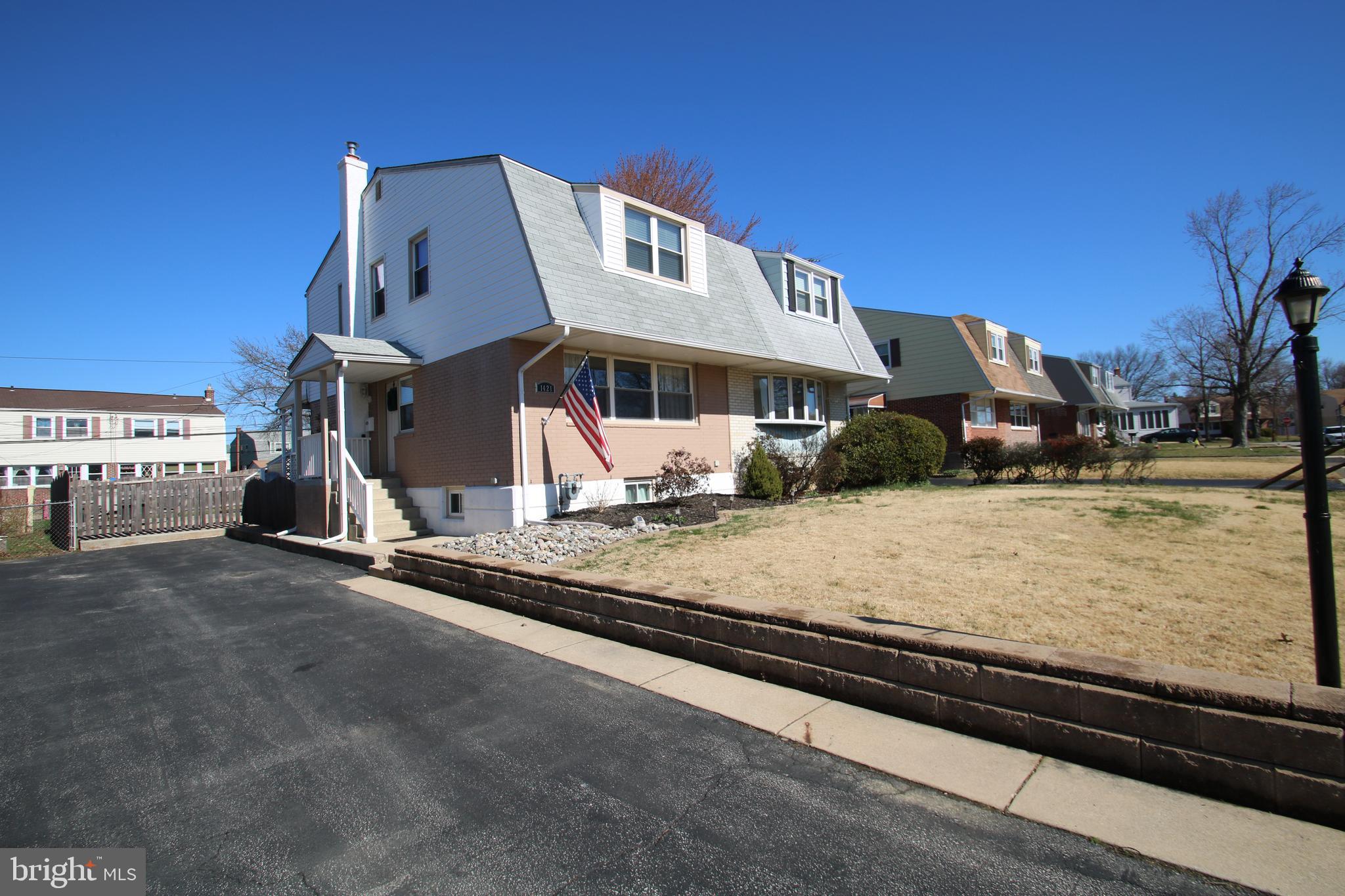1421 Blackrock Road Swarthmore, PA 19081 - Photo 1 of 41 a front view of a house with a yard