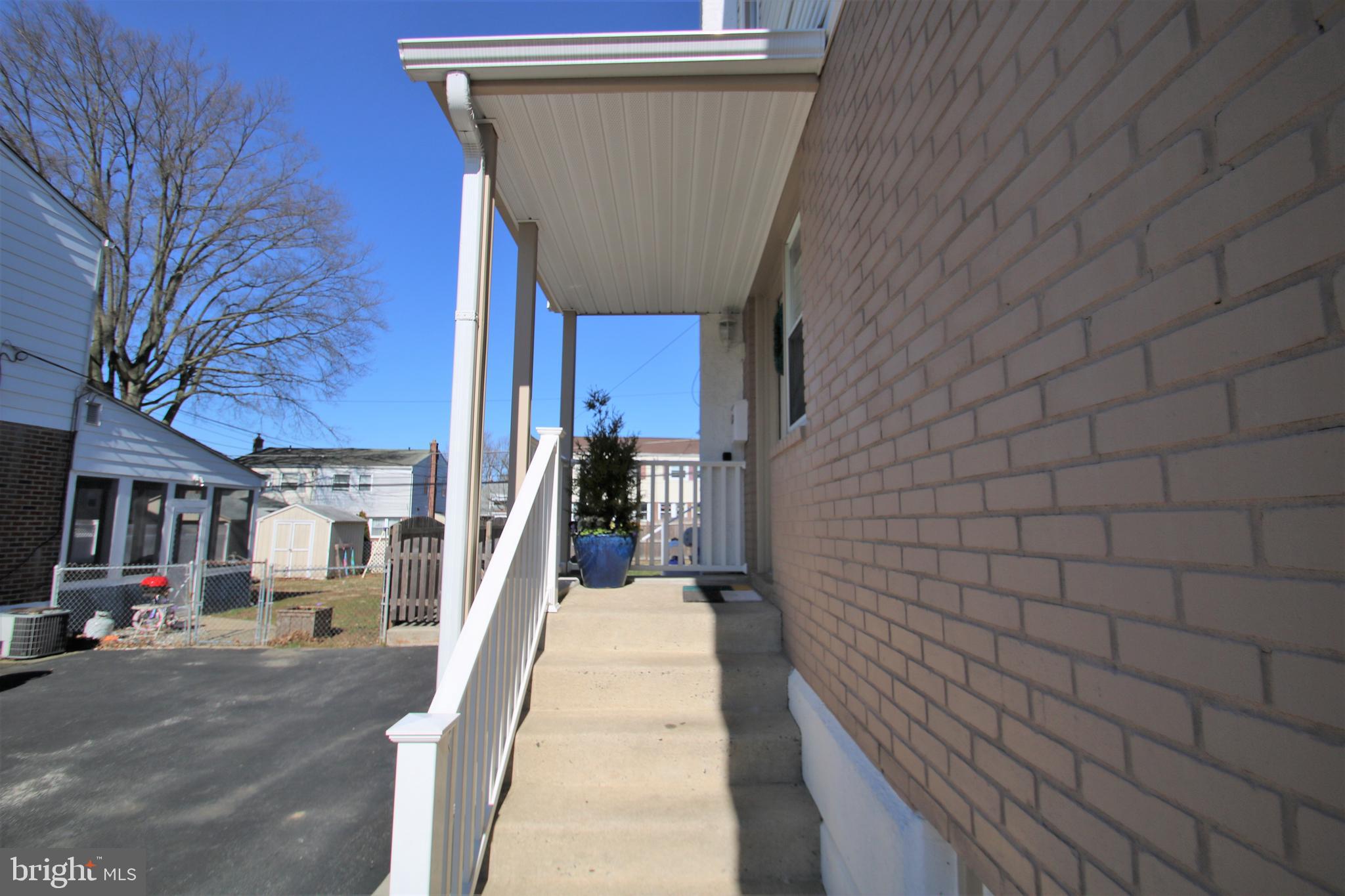 1421 Blackrock Road Swarthmore, PA 19081 - Photo 4 of 41 a view of a brick house with many windows