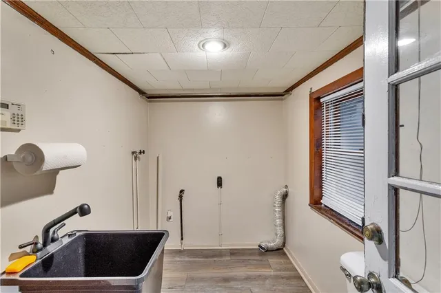 a view of an entryway with wooden floor