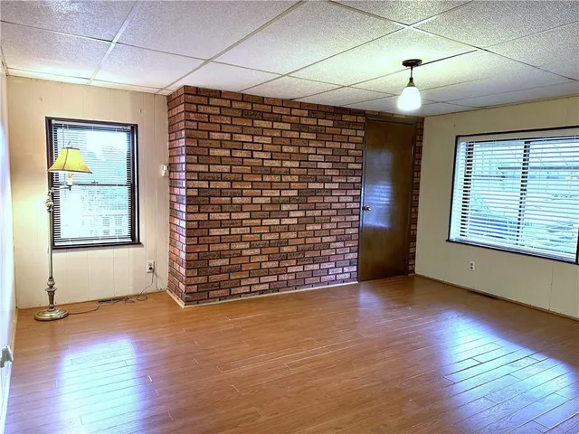 a view of a large window with wooden floor