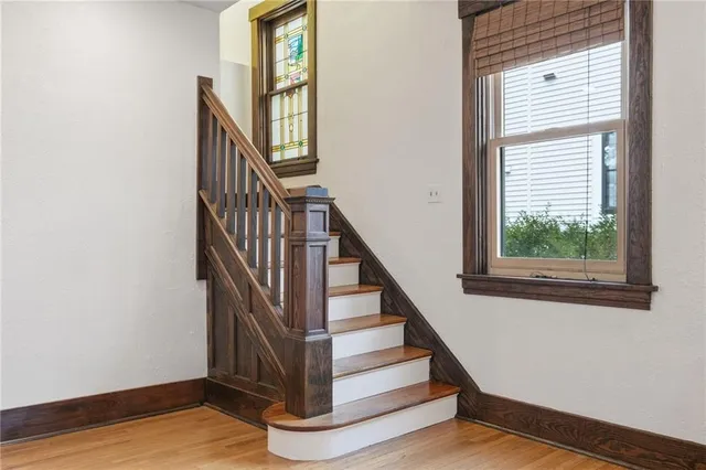 a view of entryway and hall with wooden floor