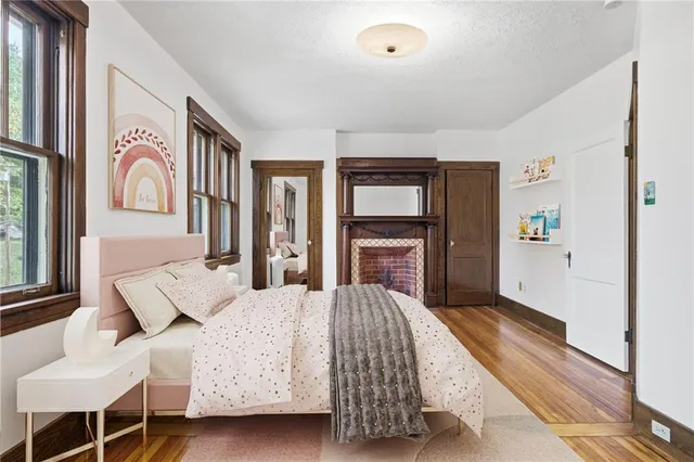 a bedroom with a bed couch and a window