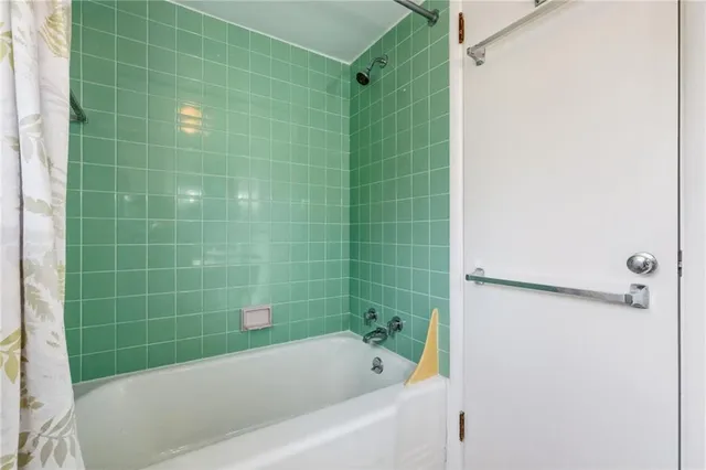 a view of empty room with wooden ceiling