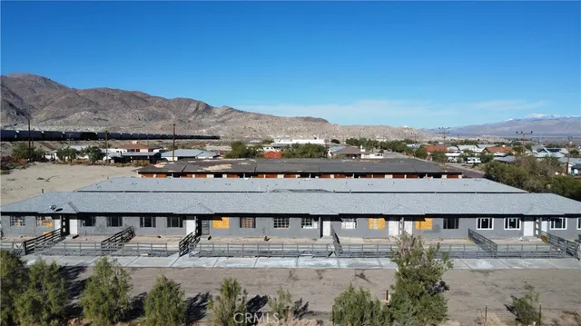 a view of a large building with a mountain in the background